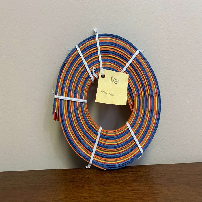 Half inch and three eighths inch pre dyed colored flat reeds from HH Perkins. 4 ounce coils measuring approximately 100 feet per coil in length.