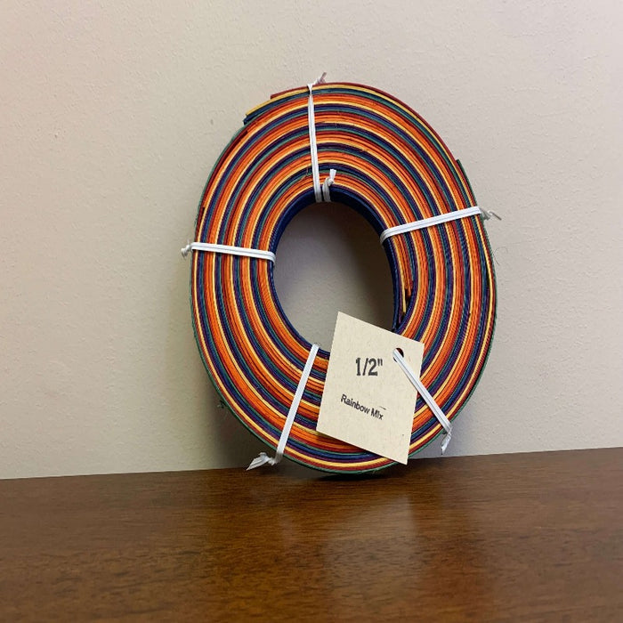 Half inch and three eighths inch pre dyed colored flat reeds from HH Perkins. 4 ounce coils measuring approximately 100 feet per coil in length.