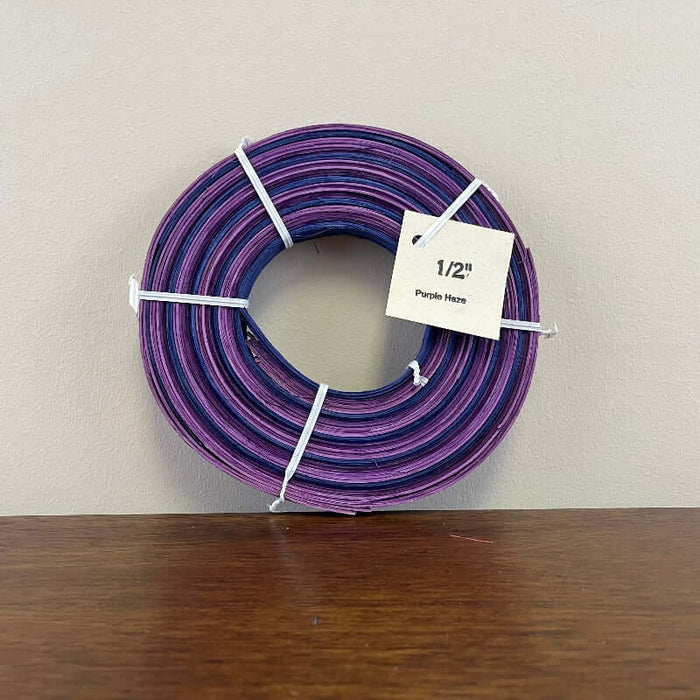Half inch and three eighths inch pre dyed colored flat reeds from HH Perkins. 4 ounce coils measuring approximately 100 feet per coil in length.