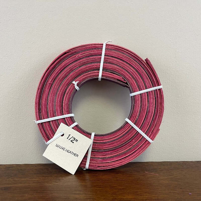 Half inch and three eighths inch pre dyed colored flat reeds from HH Perkins. 4 ounce coils measuring approximately 100 feet per coil in length.