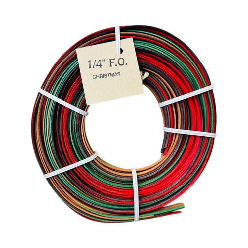 Spool of multicolored colored reeds with a label reading 1/4" FO Christmas on a white background