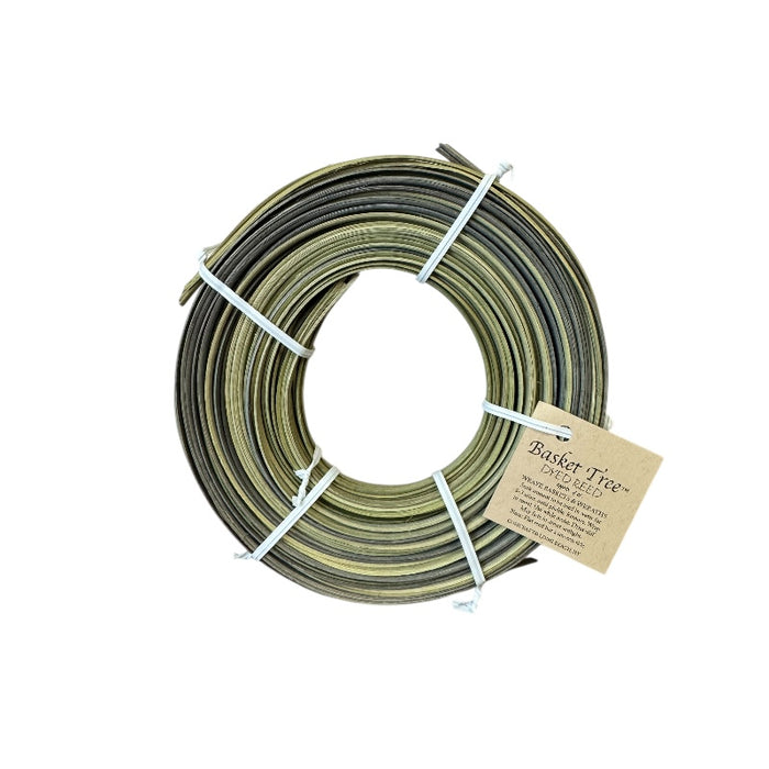 Spool of green and brown rattan reeds with a label on a white background