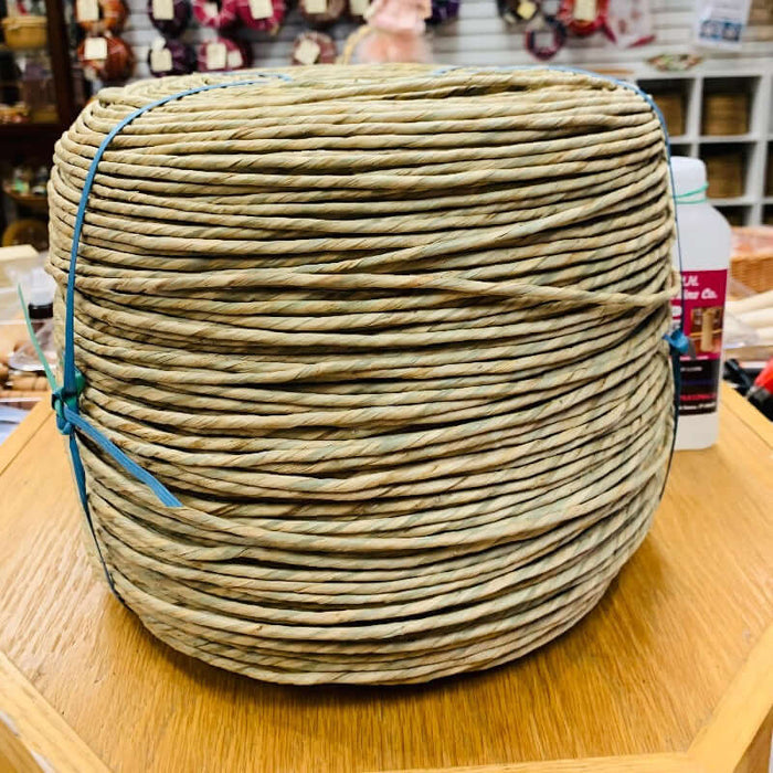 Pre Twisted Natural Rush 10lb reel from HH Perkins in the showroom on table.