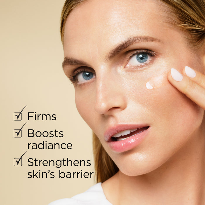 Woman applying Advanced Gold Ceramide Capsules serum to her cheek — firms, boosts radiance and strengthens skin's barrier