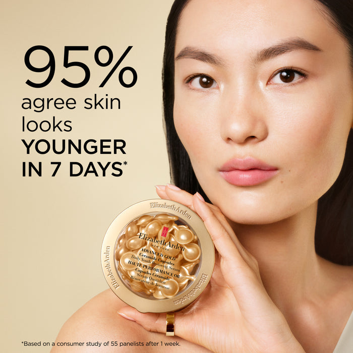 95% agree skin looks younger in 7 days — woman holding a pot of Advanced Gold Ceramide Capsules Daily Youth Restoring Serum