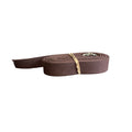 Brown shaker tape backpack straps with metal clasp on a white background