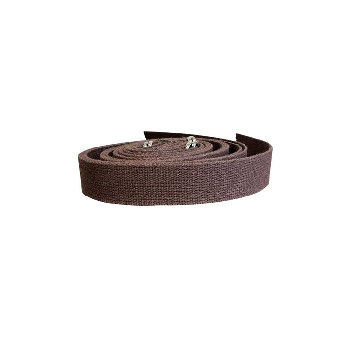 Brown shaker tape backpack straps with metal clasp on a white background