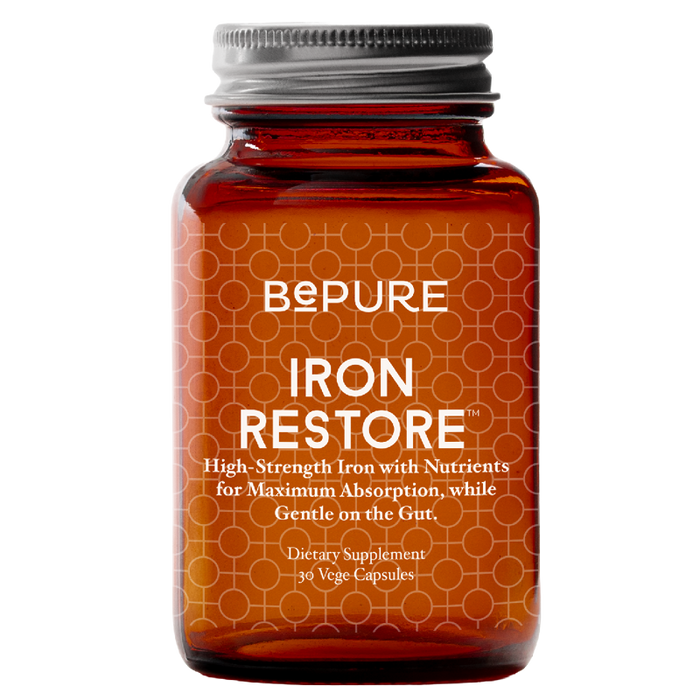Bottle of BePure Iron Restore supplement on a white background