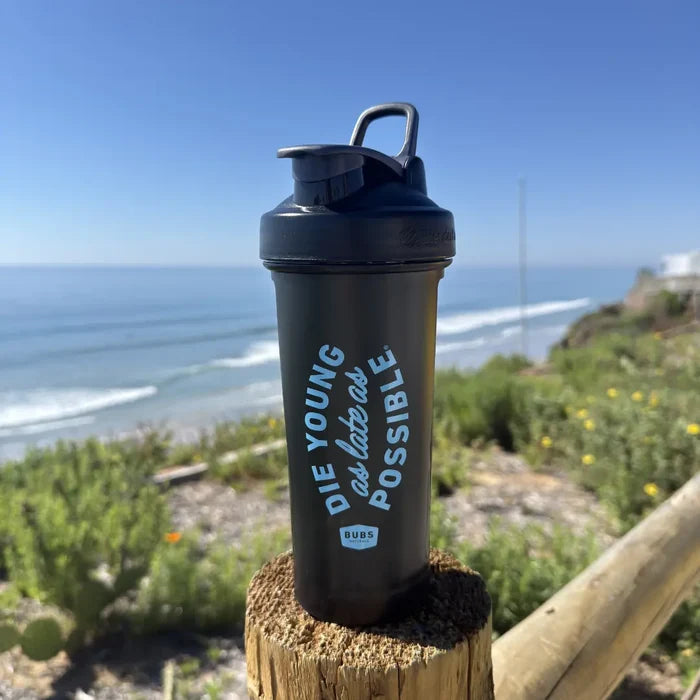 BUBS Naturals Classic Blender Bottle on a coastal overlook