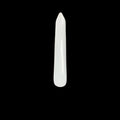 A bone awl with a tapered and rounded edge, placed on a wooden surface.