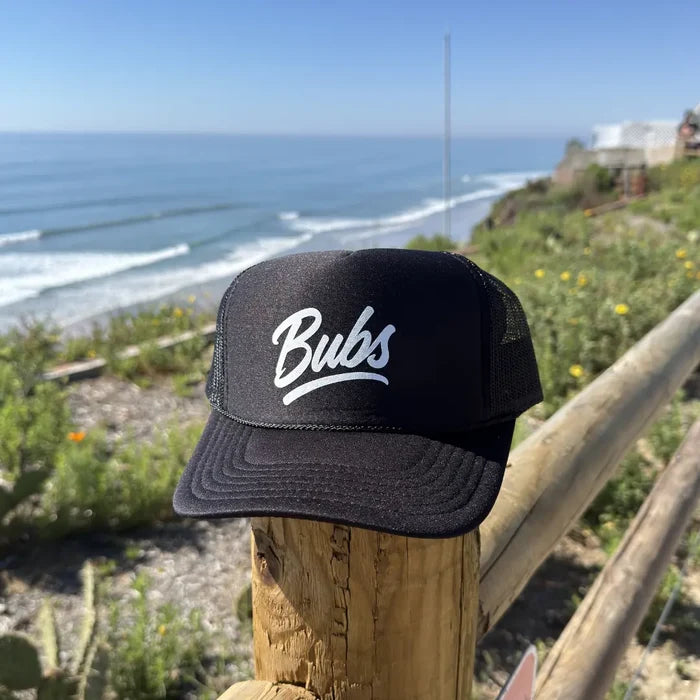 BUBS Black Trucker Hat side view outdoors