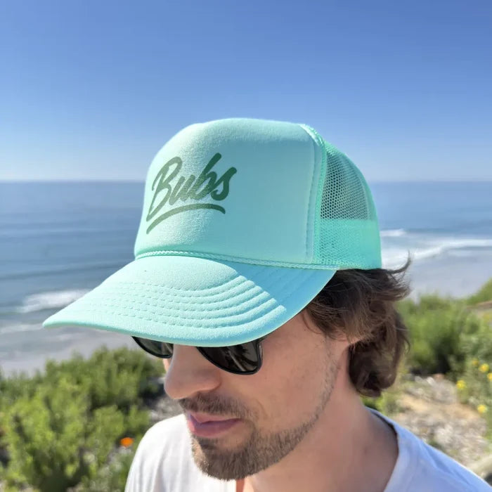 Person wearing a BUBS Seafoam Trucker Hat outdoors