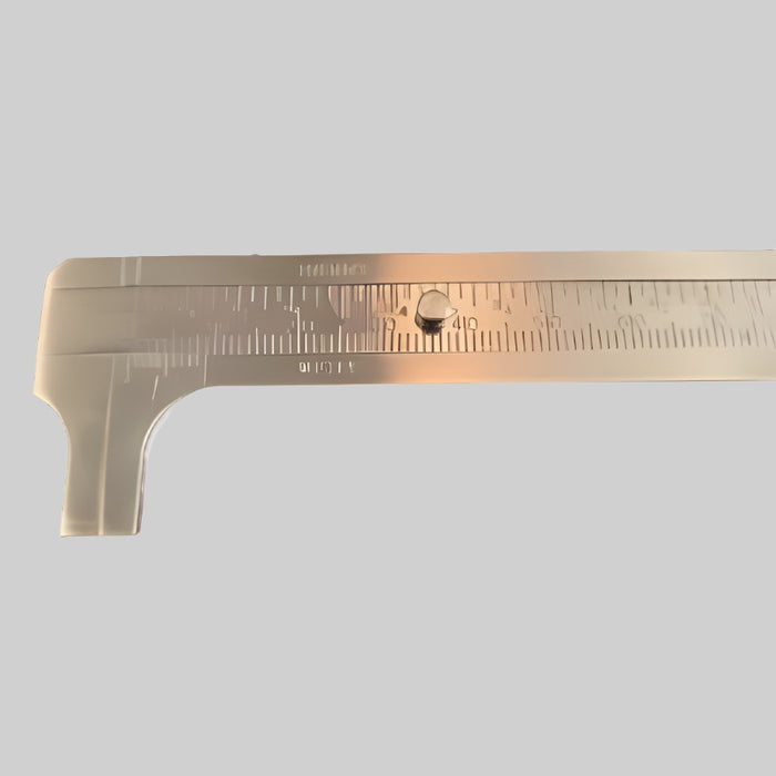 Brass caliper on gray background.