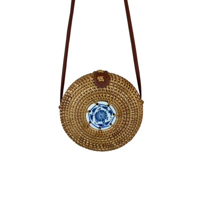 Artisan rattan canteen handbag with unique design, crossbody strap, and premium craftsmanship.