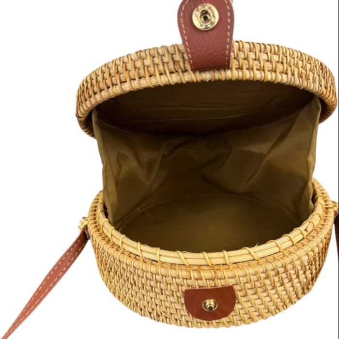 Open artisan rattan canteen handbag with nylon lining and strong clasp, showcasing unique handcrafted design.