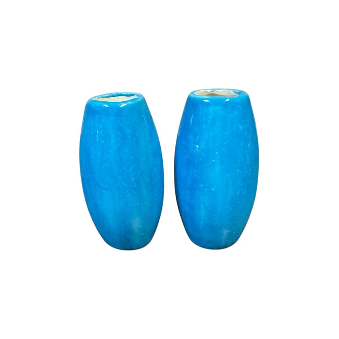 Two blue ceramic vases on a white background