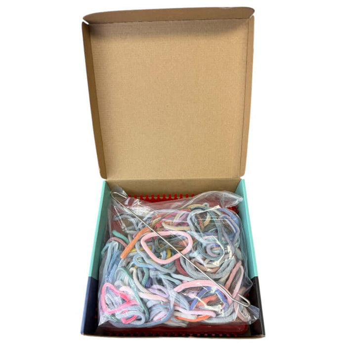 Open Kit showing the materials that are included in the Metal Weaving Loom DIY kit.