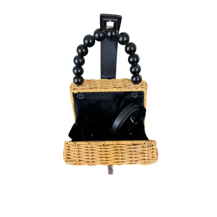 Mini wicker handbag with beaded purse handle and chrome clasp open to show detachable handle and where to attach it.