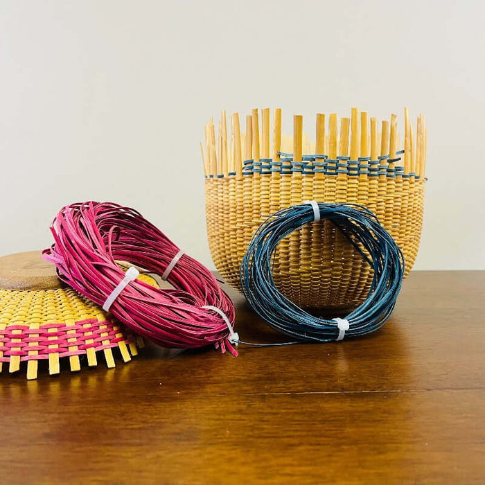 Pre-dyed Hamburg colored cane coils with samples of the dyed cane woven into Nantucket Baskets.