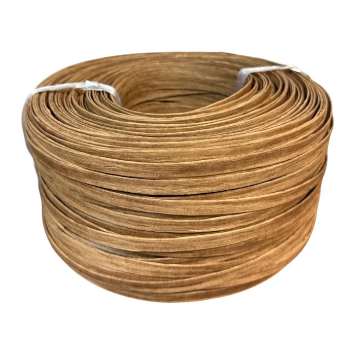 A ten-pound coil of custom rolled fiber splint on a white background