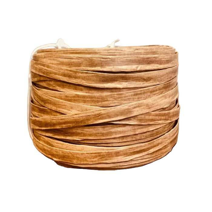 Brown Fiber Rush on a coil on a white background.