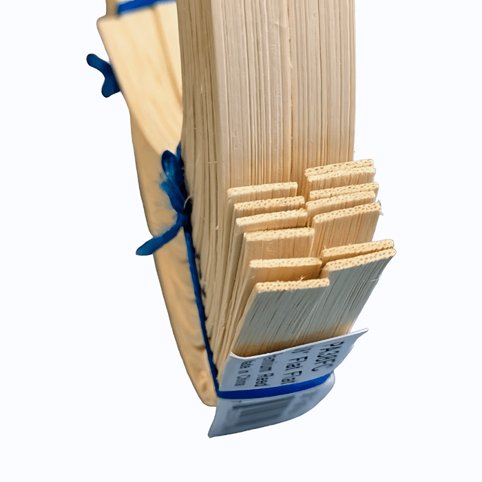 Close up of rattan strips on 3/8" flat reed half pound coil.