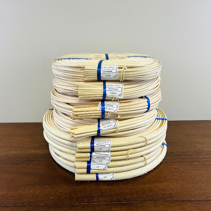Half Round Reed coils by size stacked on top of eachother.