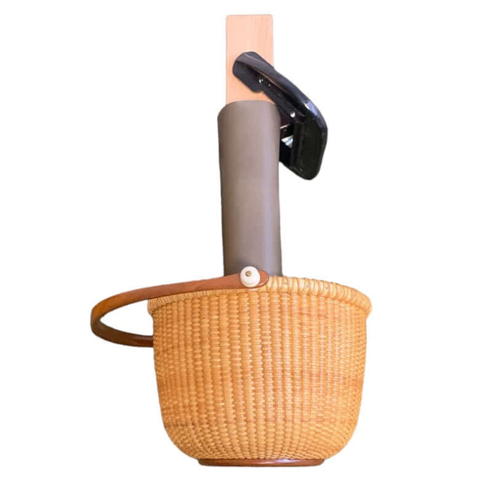 Leather covered hammer block with Nantucket basket on the end.