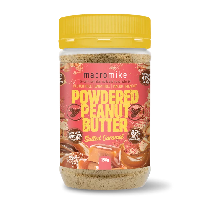 Jar of macromike powdered peanut butter with a yellow lid on a white background