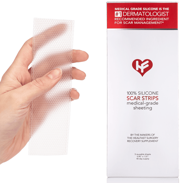 A hand holding a strip of medical grade silicone scar sheeting next to packaging.
