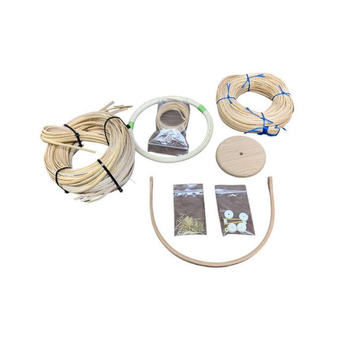 Nantucket Basket Replacement Kit includes 5mm Binder Cane Staves, Cherry Base, Cherry Handle, Rattan Reed Rim, strand cane, binder cane, washers, pins, and directions.