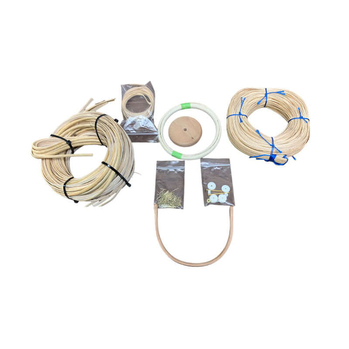 Nantucket Basket Replacement Kit includes 5mm Binder Cane Staves, Cherry Base, Cherry Handle, Rattan Reed Rim, strand cane, binder cane, washers, pins, and directions.