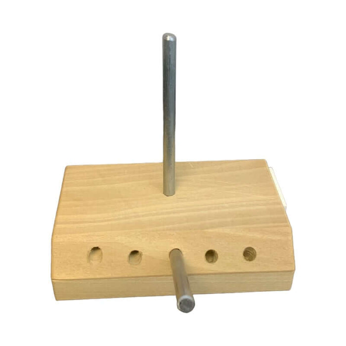Mold Stand with long metal dowel inserted into hole on top of the stand, and smaller dowel inserted into center hole on the front.