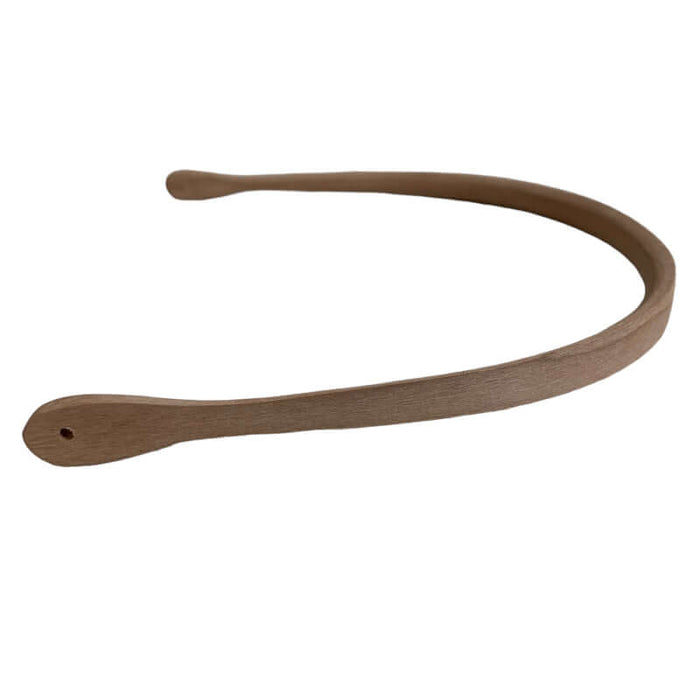 A Nantucket Round cherry handle on its side showing the drilled holes where you attach  the handle to your Nantucket basket.