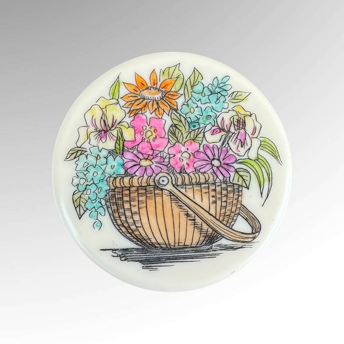 Nantucket acrylic Scrim Disc Flower Bouquet Basket with blue, pink, orange, green, and white flowers.