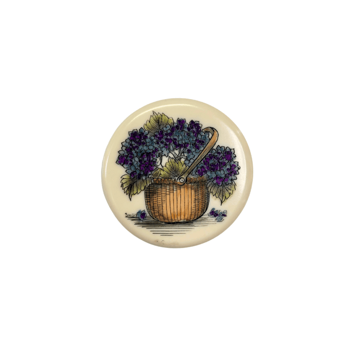A circular acrylic scrim disc with a floral design, presumably intended as a decorative element for crafting
