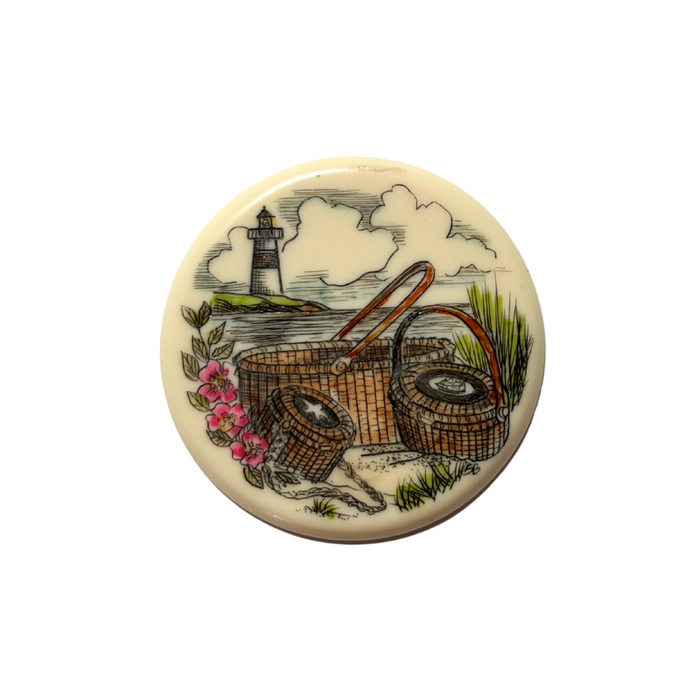 Acrylic scrim disc for Nantucket Basket weaving with a lighthouse, 3 baskets, and flowers on the sea.