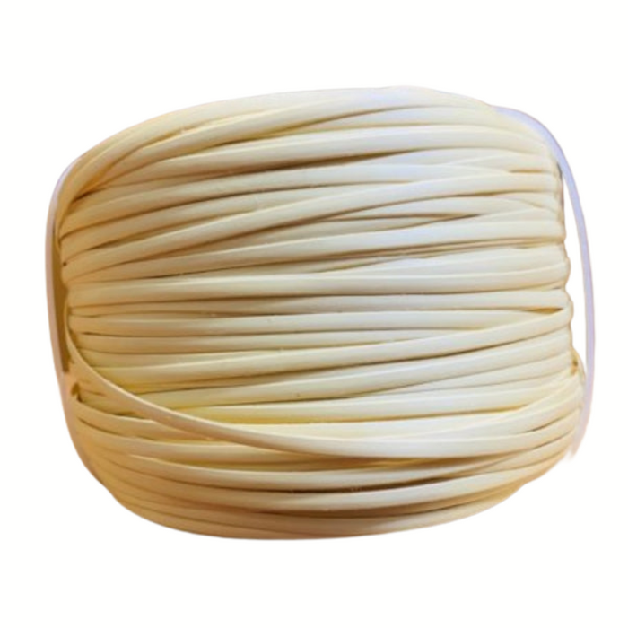 A coil of beige plastic strand cane, used for caning in furniture such as chairs and canoes.