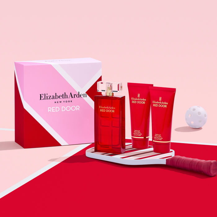 Elizabeth Arden Red Door perfume set on a pink background