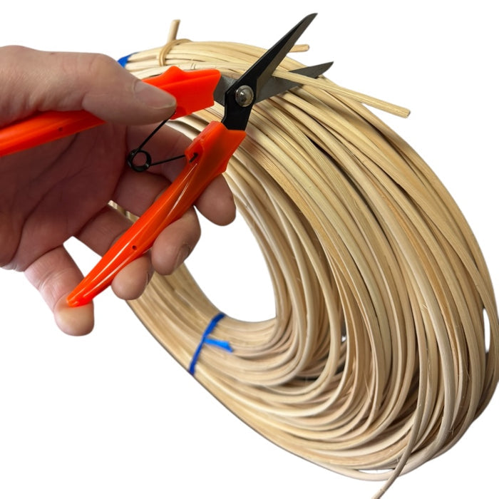 Hand operated Reed Cutter in action cutting half round reeds.