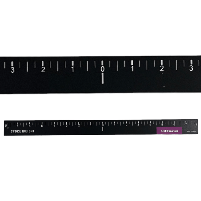 Two spoke weights for basket weaving with ruler capabilities.