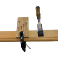 Stave Shaver fastened to a wooden table with a c-clamp and a 1" chisel.