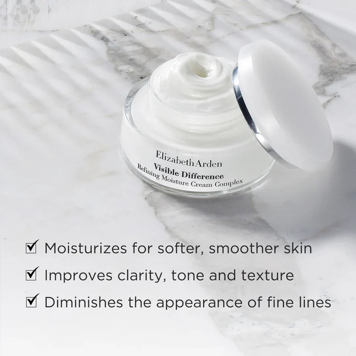 Elizabeth Arden Visible Difference cream jar on a marble surface with product benefits listed.