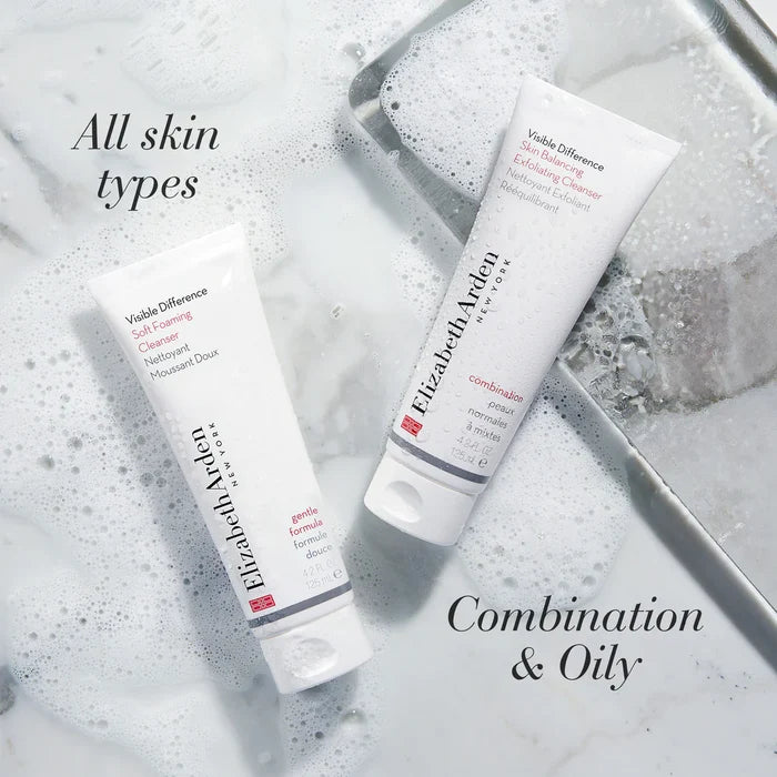 Two Elizabeth Arden skincare products - Visible Difference Soft Foaming Cleanser & Visible Difference Skin Balancing Exfoliating Cleanser -  on a textured surface with text indicating suitability for combination and oily skin.